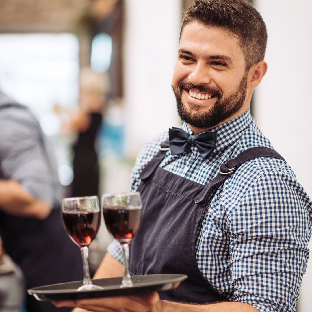 man serving wine